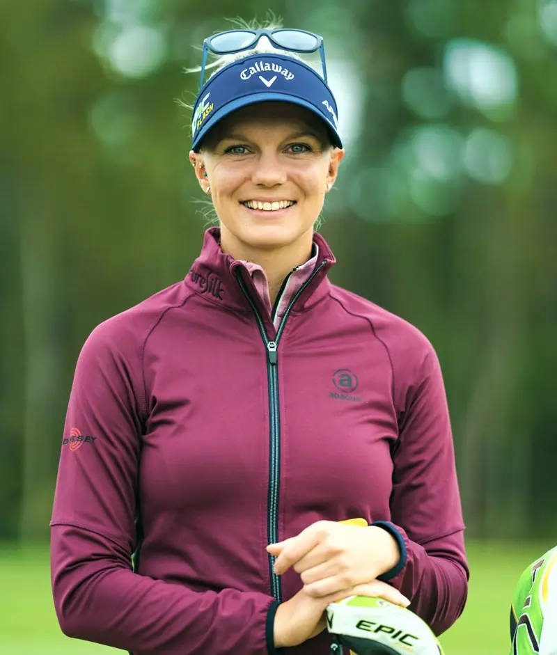 Posed, sponsor-ready portrait of Madelene Sagström on the course